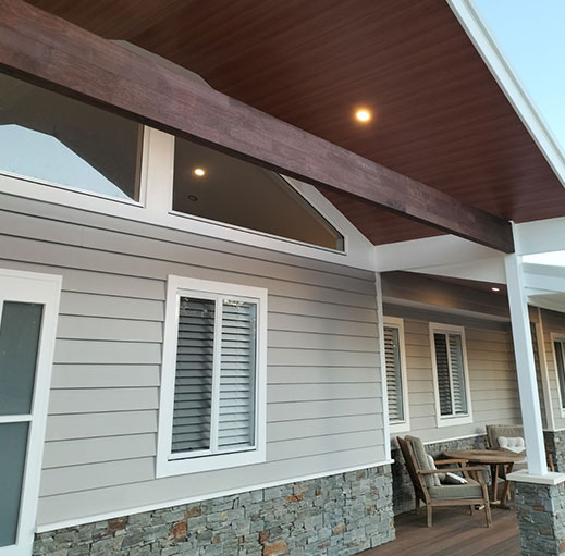 Front of house with ceiling panels and lights on